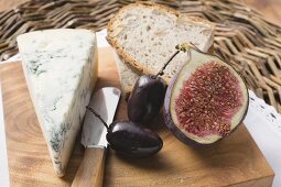 Piece of blue cheese, half a fig, olives and bread