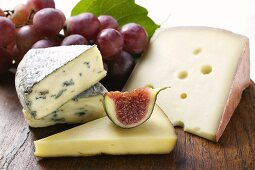 Cheese still life with fig and grapes