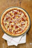 Ham, cheese and tomato pizza