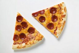 Two slices of American-style pepperoni pizza