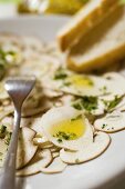 Cep carpaccio with olive oil and herbs