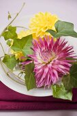 Summer table decoration of dahlias and ivy