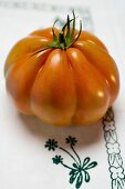 Tomato on tablecloth