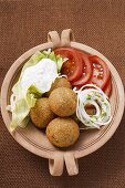 Falafel (chick-pea balls) with tomatoes and yoghurt dip