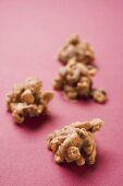 Nut sweets on pink background