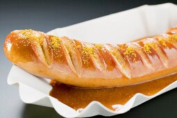 Currywurst (sausage with ketchup & curry powder) in paper dish