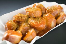 Currywurst (sausage with ketchup & curry powder) in paper dish