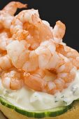 Half bread roll topped with shrimps, cucumber & remoulade