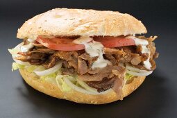 Döner kebab with onions, tomatoes and yoghurt sauce