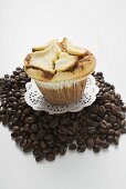 Muffin on a heap of coffee beans