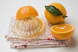 Oranges with citrus squeezer