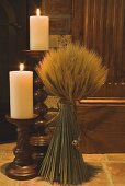 Autumn decorations: candles and cereal sheaf