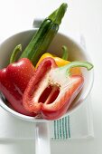 Peppers and courgette in strainer
