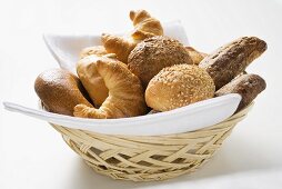 Bread rolls and croissants in bread basket