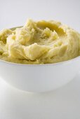 Mashed potato in white bowl