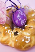 Plaited bread ring with purple Easter egg to hang up (detail)