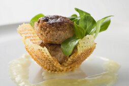 Meat patties with corn salad in potato nest