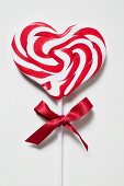 Candy cane lollipop with red bow
