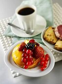 Small berry cake and cup of coffee