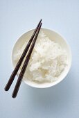Bowl of rice with chopsticks