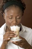 Woman drinking latte macchiato