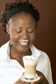 Woman drinking latte macchiato