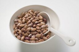 Borlotti beans in bowl with spoon