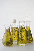 Four different herb oils in bottles
