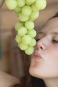 Woman with green grapes