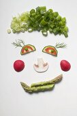 Lustiges Gesicht aus Gemüse, Dill und Champignon