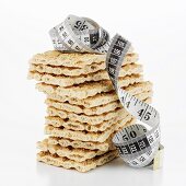 Crispbread, in a pile, with tape measure