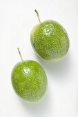 Two green passion fruits