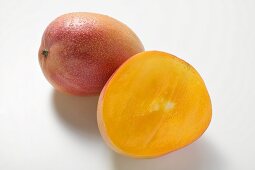 Whole mango and half a mango