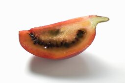 A wedge of tamarillo