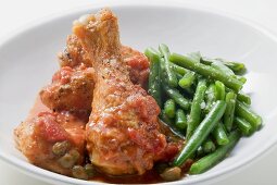 Chicken with tomato sauce, capers and green beans