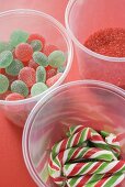 Jelly sweets, candy canes and red sugar