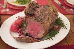 Roast rib of beef on Christmas table