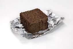 Slices of black bread in aluminium foil