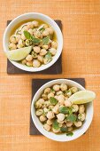 Chick-peas with lime wedges and herbs