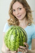 Woman holding watermelon