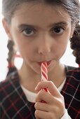 Girl eating candy stick