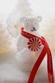 Polar bear candle with peppermint and ribbon