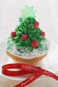 Christmas cupcake on plate with ribbon