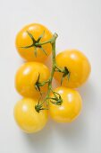 Five yellow cherry tomatoes