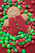 Gingerbread man on red and green chocolate beans