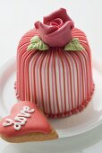 Marzipan-covered cake & heart-shaped biscuit (Valentine's Day)