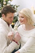 Man and woman drinking sparkling wine (Christmas)