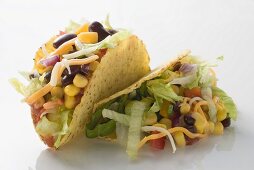 Two tacos filled with sweetcorn and beans