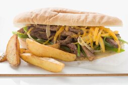 Steak and cheese sandwich with potato wedges