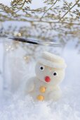 Small marzipan snowman in snow